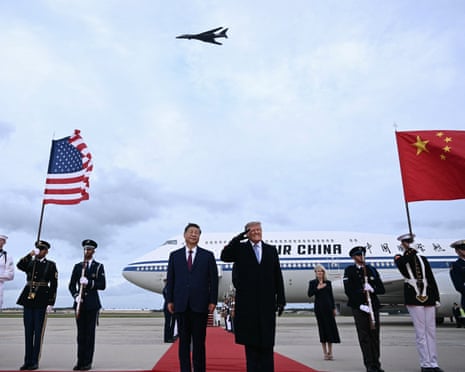 Donald Trump reacts after a B1 bomber flew past during the national anthems while he greeted Xi Jinping.