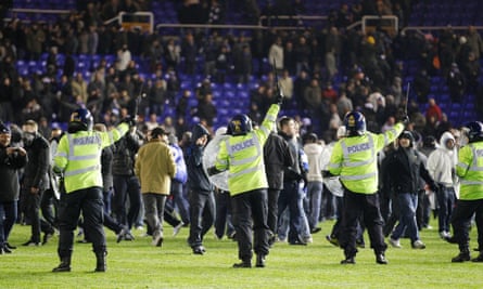 Riot police try to control fans after Birmingham beat Aston Villa at St Andrews.