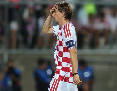 Luka Modric with his hand on his head