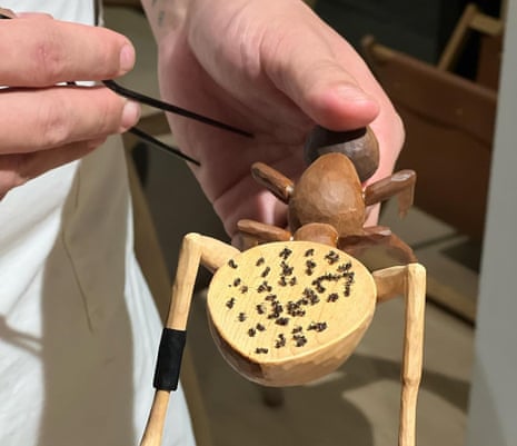 Ants laid out on a wooden ant decoration