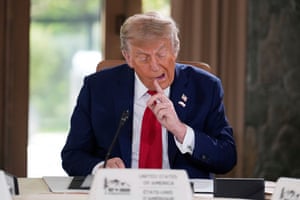 Donald Trump seems to pick at his teeth with his index finger