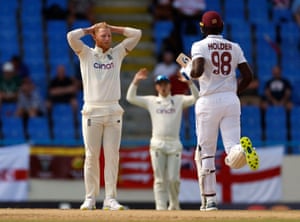 Ben Stokes holds his head as Holder hits a run.