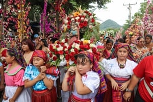 A cluster of young women in bright traditional clothing