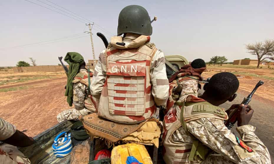 A convoy of Nigerien soldiers patrolling outside the town of Ouallam, Niger