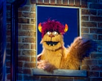 Trekkie Monster puppet in window during Avenue Q production