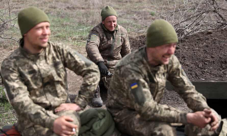 Ukrainian artillerymen stand on the front line near Lugansk, in the Donbas region.