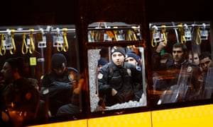 Police officers stand inside a damaged bus after the bomb attacks outside Besiktas’s stadium that killed 38 people last year.