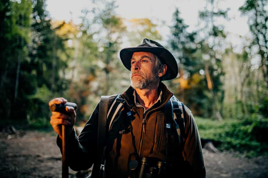 The outdoor educator Chris Salisbury in woodland near the River Dart in Devon.