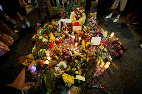 Signs, candles and flowers near Dolly Parton’s star on the Hollywood Walk of Fame after it was announced that the country music icon died aged 80, in Los Angeles, California.