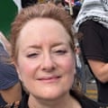 A woman amid a crowd outdoors.