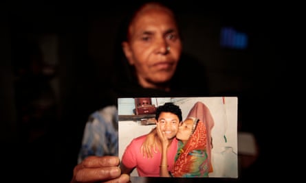 Fatima Munshi holds a photo of the moment she was reunited with her son, Saroo, after 25 years apart.
