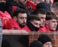 The Manchester United captain, Bruno Fernandes, sits on the bench after not being selected for his team's home Premier League game against Bournemouth.