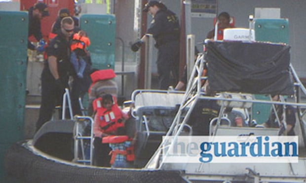 Australian customs vessel lands 157 Tamil asylum seekers on the Cocos Islands in July 2014