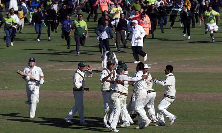 Pakistan fans run to congratulate their team after victory over England at Old Trafford in 2001.