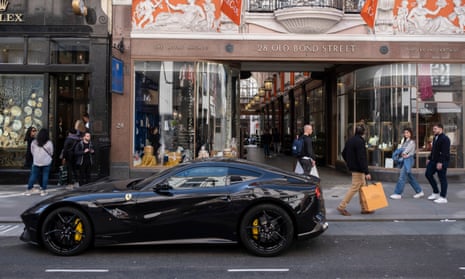 Ferrari car parked outside the Royal Arcade along Bond Street in London, United Kingdom