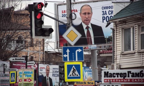 Campaign billboards for president Putin are displayed in Simferopol 