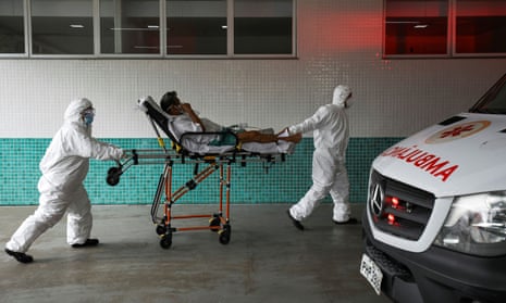 A Covid patient is taken to hospital in Manaus. More than 206,000 people have now died across Brazil, the second highest total in the world after the US.