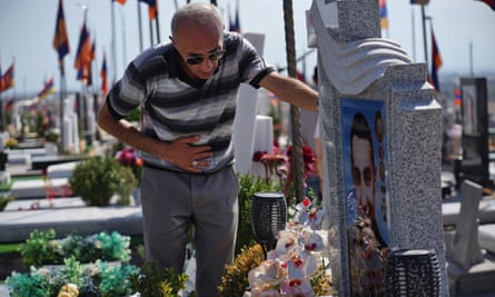 Artur Kirakosyan at his son Artyom’s grave