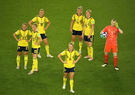 The Swedish players await the VAR decision.