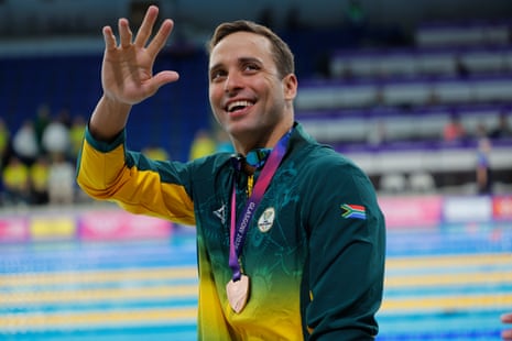 A smiling Chad le Clos wears his bronze medal as he waves to the crowd after South Africa came third in the men's 4 x 100m freestyle relay final.