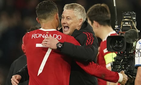 Manchester United’s manager Ole Gunnar Solskjaer (right) hugs Manchester United’s Cristiano Ronaldo after the final whistle.