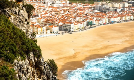 golden beach and rocky headland.