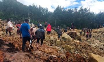 People searching among mud and rocks