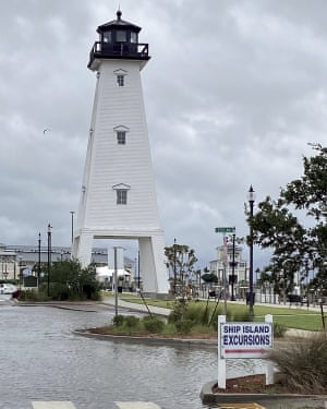 The parking lot adjacent to the Jones Park Lighthouse in Gulfport, Miss., floods from the waters from the Gulf of Mexico cresting before Hurricane Sally reaches land.