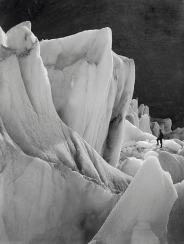 A tiny figure stands on a Glacial Surface in South Georgia