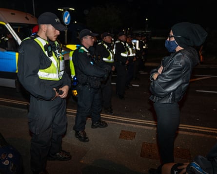 An anti-migrant protester faces a cordon of police at Gosport, Hampshire, on 22 September.