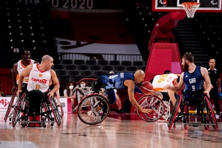 Top scorer Gaz Choudhry being unseated during the wheelchair basketball bronze medal match.