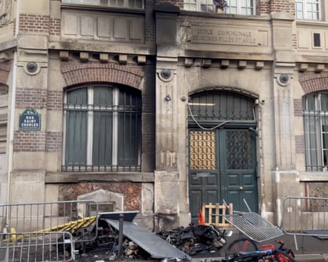 Lycee Beaugrenelle in Paris has its building facade set on fire during clashes between students and police.