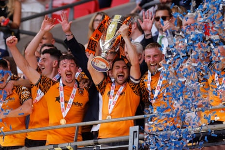 Lewis Coyle lifts the trophy