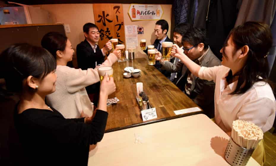 Employees of Japanese company Suntory drink at a pub after finishing work at 3pm in Tokyo