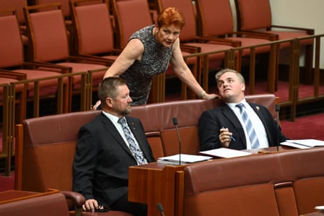 Pauline Hanson speaks to One Nation senators Sean Bell (right) and Tyron Whitten in March