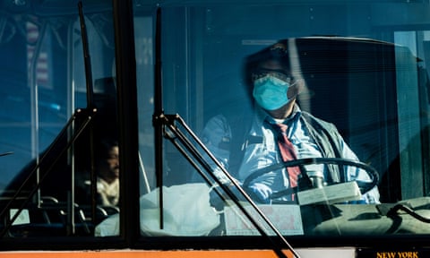 A bus driver wearing a face mask in New York City on 17 April 2020. 