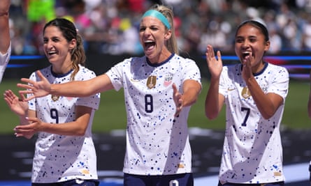 USA players Savannah DeMelo, Julie Ertz and Alyssa Thompson cheer after an international friendly against Wales earlier this month