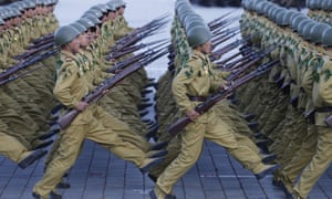 North Korean soldiers march during a mass military parade in Pyongyang. China has warned the US and Kim Jong-un’s regime are heading toward a crisis.