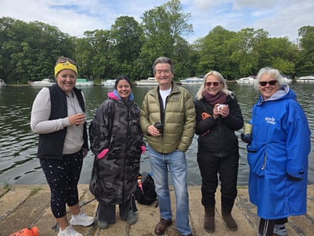 Margot Cooper, Nicky, Feargal Sharkey, Monika Kennedy, Claire Wilmot smile as they stand by the Thames