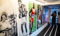 The Olympic Games: Mirror of Societies exhibition wall featuring blown-up pics of athletes over the decades