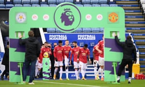 The Manchester United players take to the pitch.