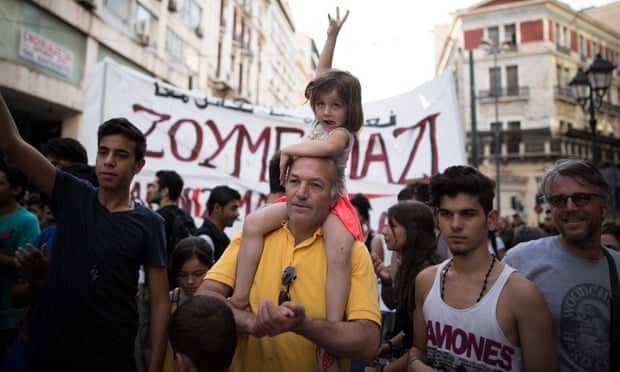 People demonstrate in support of refugees in Athens on Thursday.