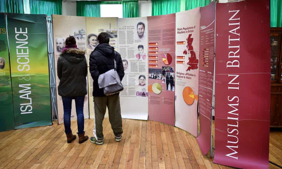 Visitors read information boards during an open day at Finsbury Park mosque in London.