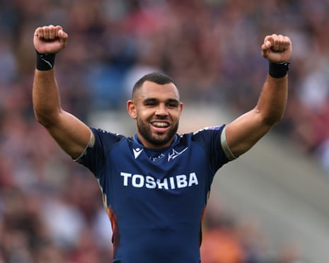 Joe Marchant with arms raised playing for Sale
