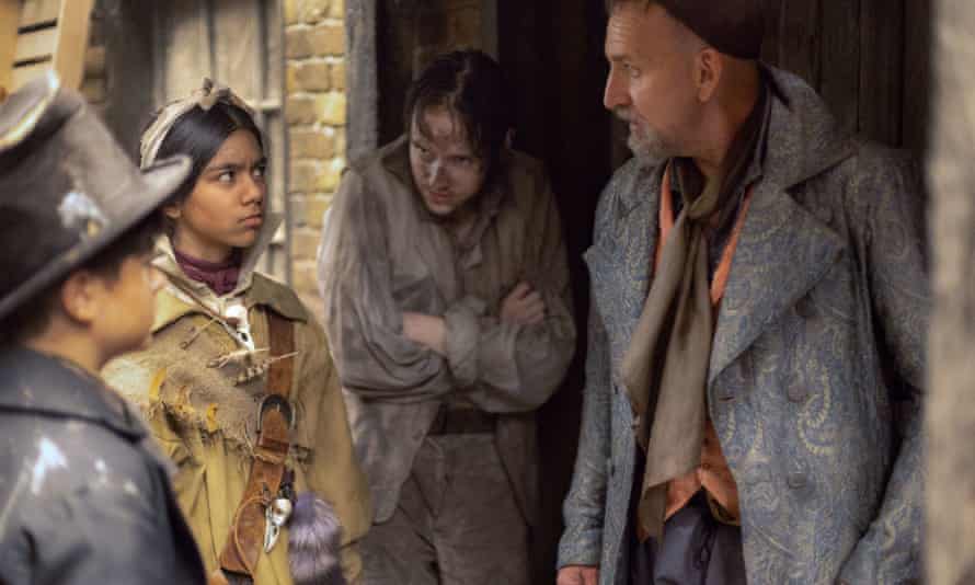 Fagin (Christopher Eccleston) and his gang of pickpockets, Jack Dawkins / Dodger, Charley Bates and, Tom Chitling (Connor Curren).