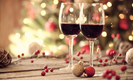 Christmas holiday red wine in front of a Christmas tree