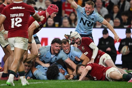 The Waratahs celebrates Ethan Dobbins’ try.