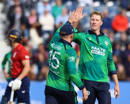 Ross Adair high fives Harry Trector after taking a catch to dismiss England’s Jacob Bethell