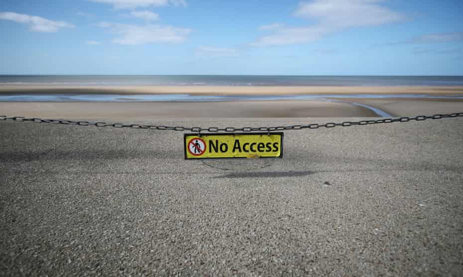 Covid warnings on a Blackpool beach