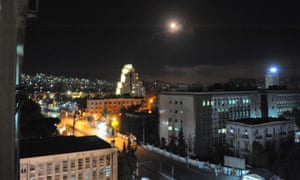 A photo released early on April 14, 2018 on the website of the official Syrian Arab News Agency (SANA) shows an explosion on the outskirts of Damascus after Western missile strikes